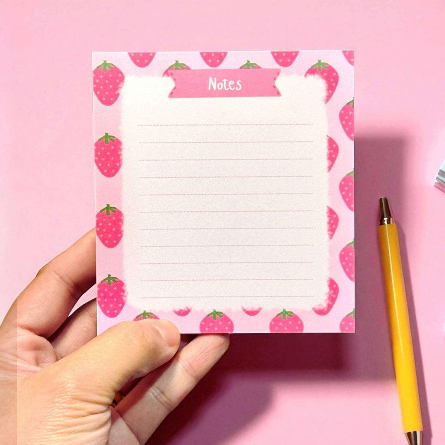 Custom notes pad with strawberry pattern border showing lined pages for writing and note-taking - fruit-themed stationery