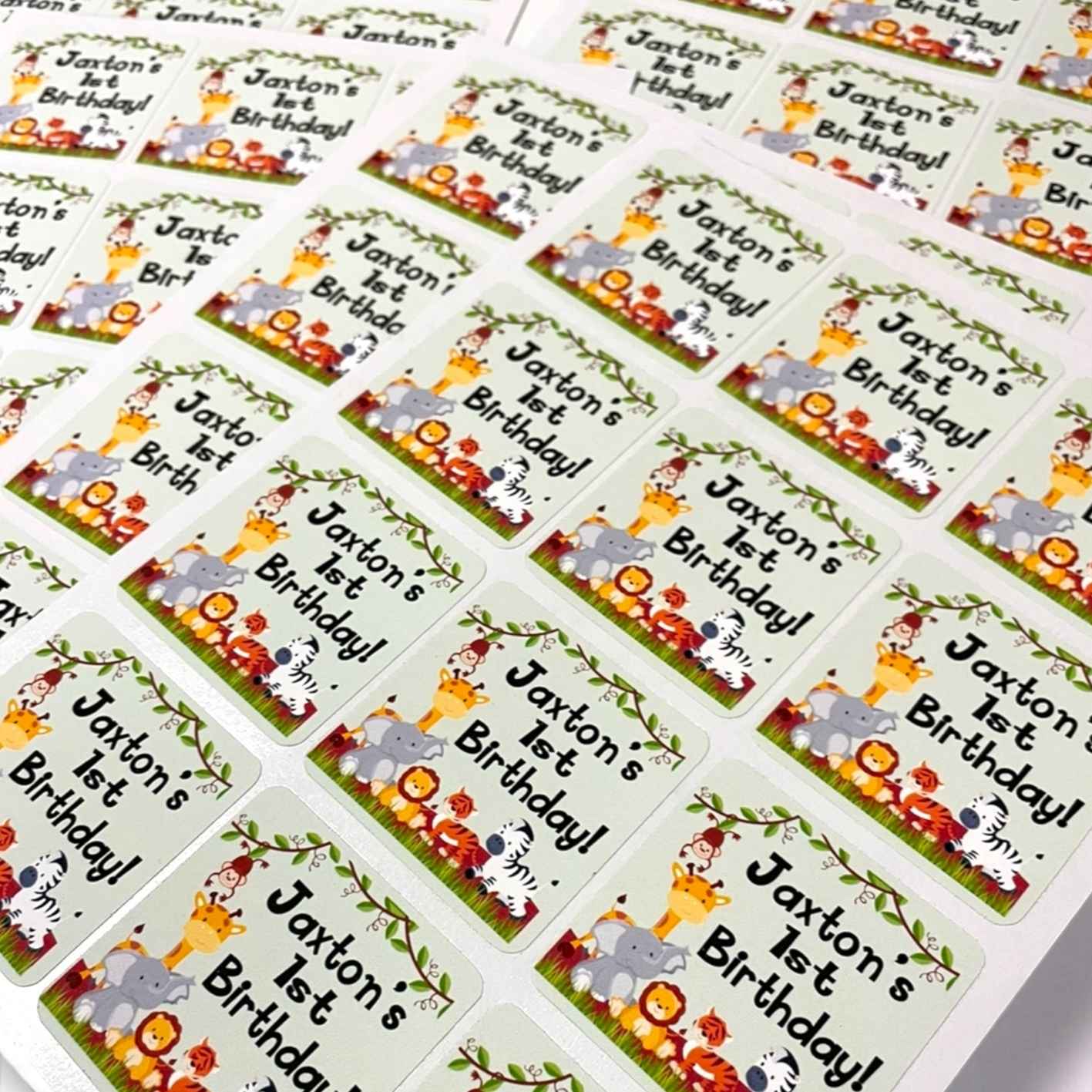 Sheet of personalized birthday labels with 'Jaxton's 1st Birthday!' text and cartoon Animal designs