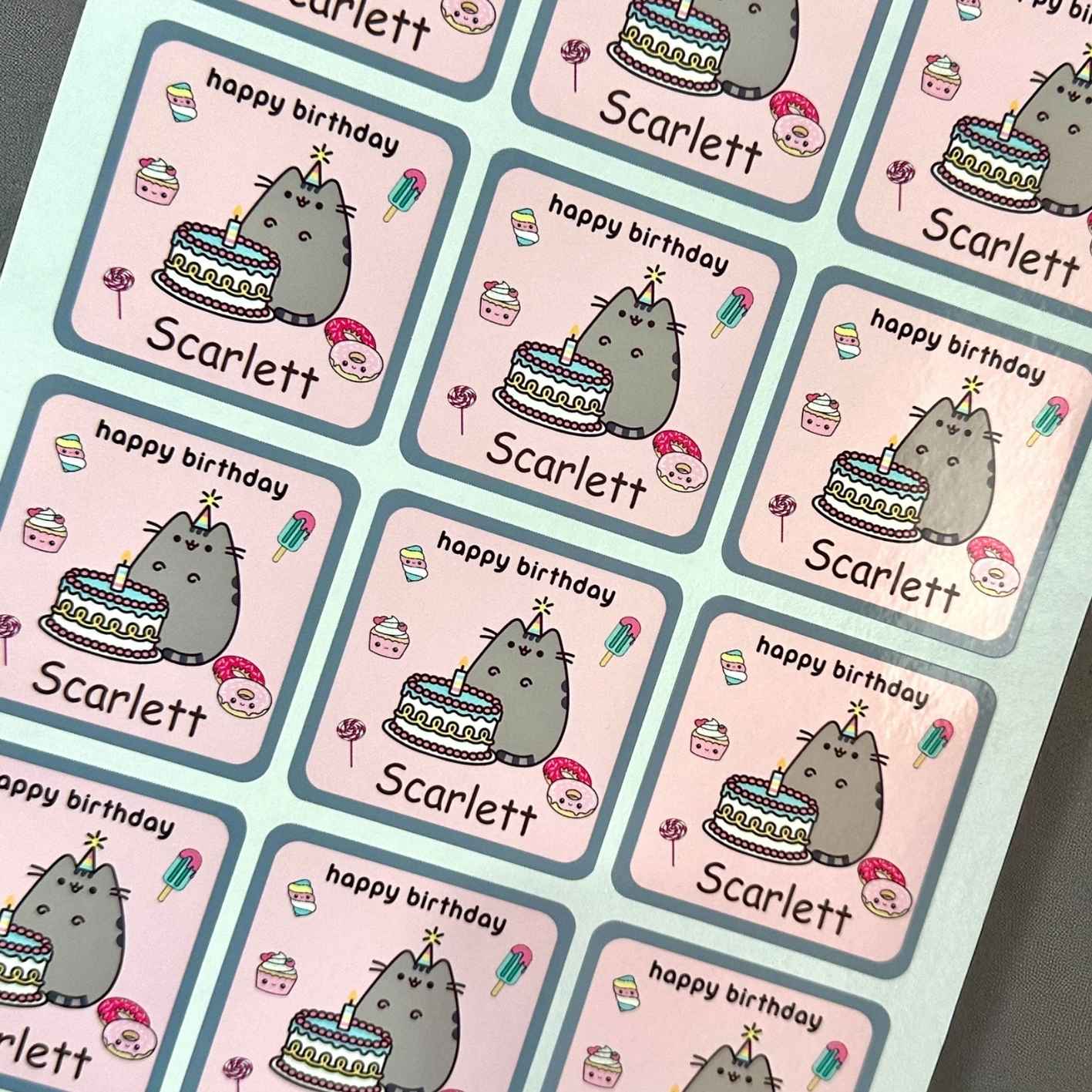 Stickers with a cat character and 'happy birthday' text, personalized with kids name.