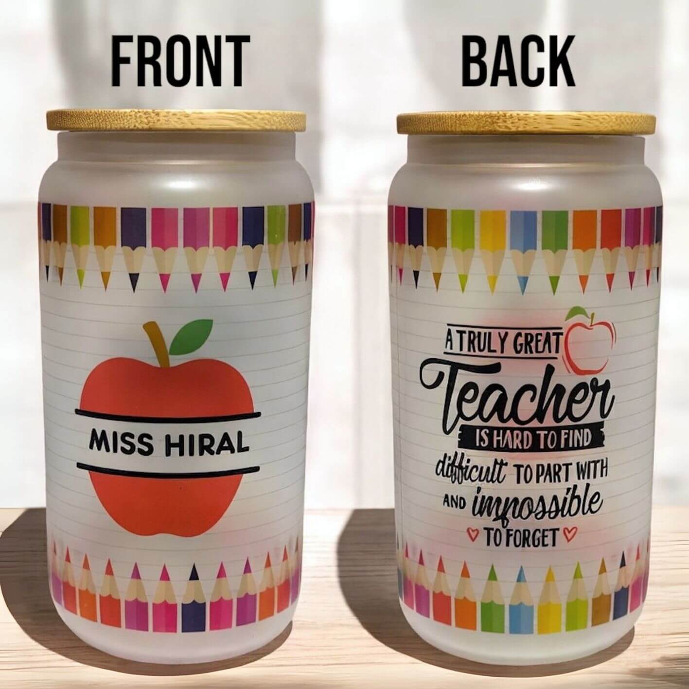 Frosted glass teacher tumbler with bamboo lid, featuring colourful pencil border, personalised red apple with teacher’s name on the front, and inspirational teacher quote on the back. Unique end-of-year teacher gift in Australia.