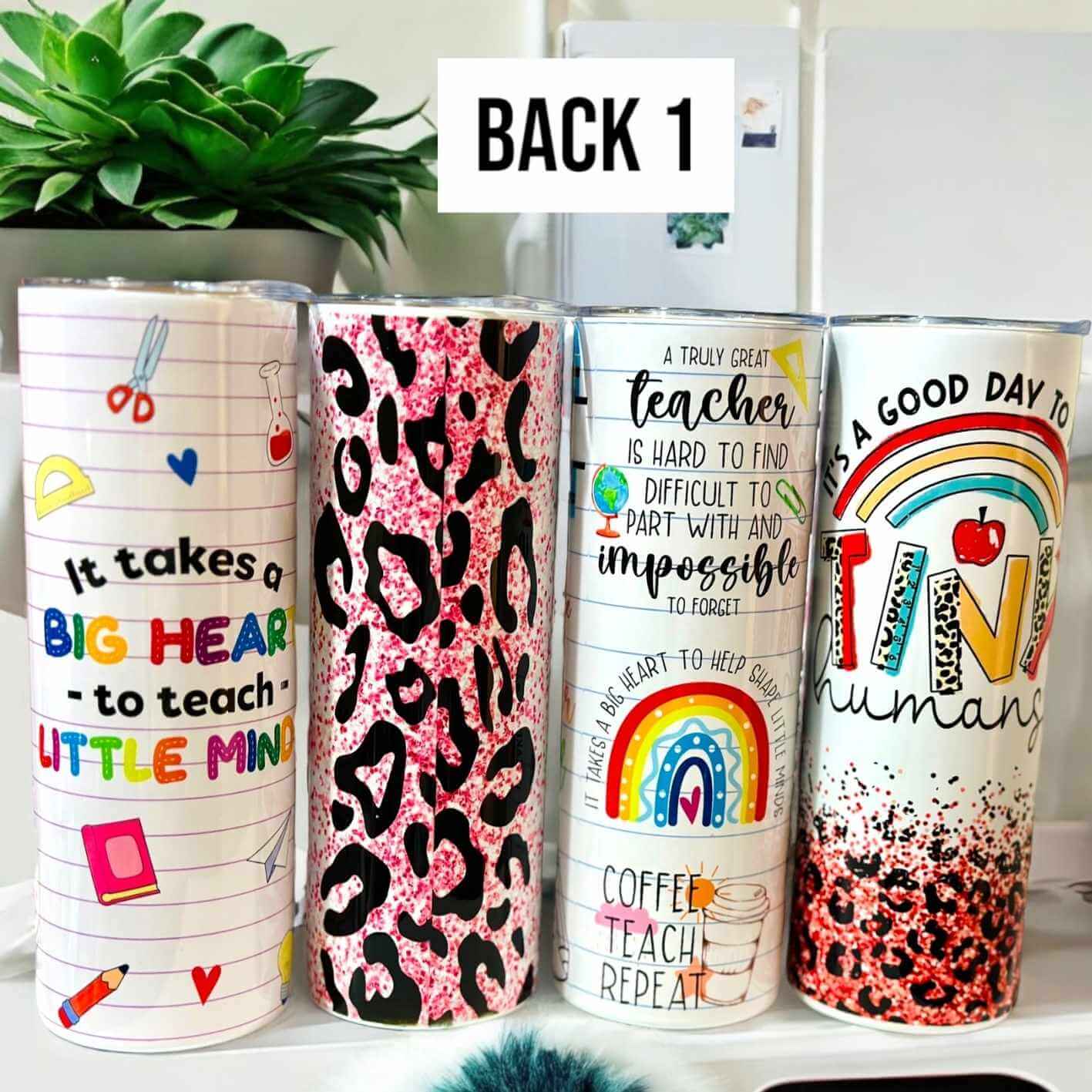 Personalised teacher tumblers with colourful designs including rainbows, leopard print, inspirational teaching quotes, and school-themed graphics, displayed on a white desk with a plant – custom drinkware gift for educators.