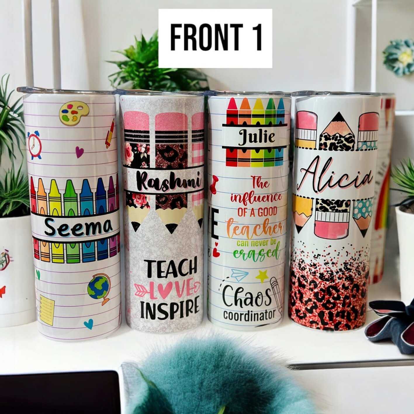 Personalised teacher tumblers with colourful crayon and pencil designs, custom names, and inspirational quotes, displayed on a white desk with plants – unique custom teacher gift idea.