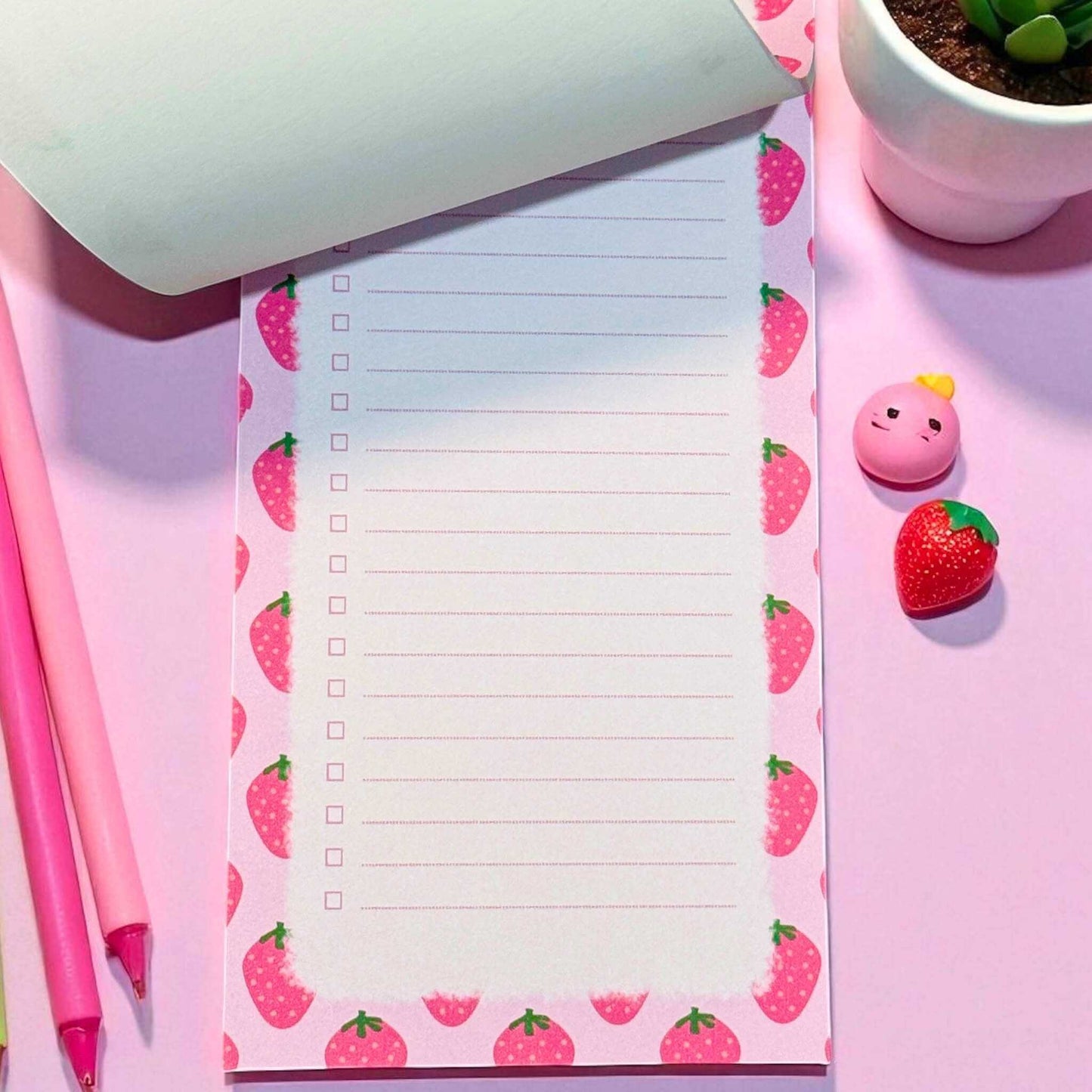 Handmade to-do list notepad with strawberry pattern shown in organised desk setup - cute planning stationery delivered across Australia