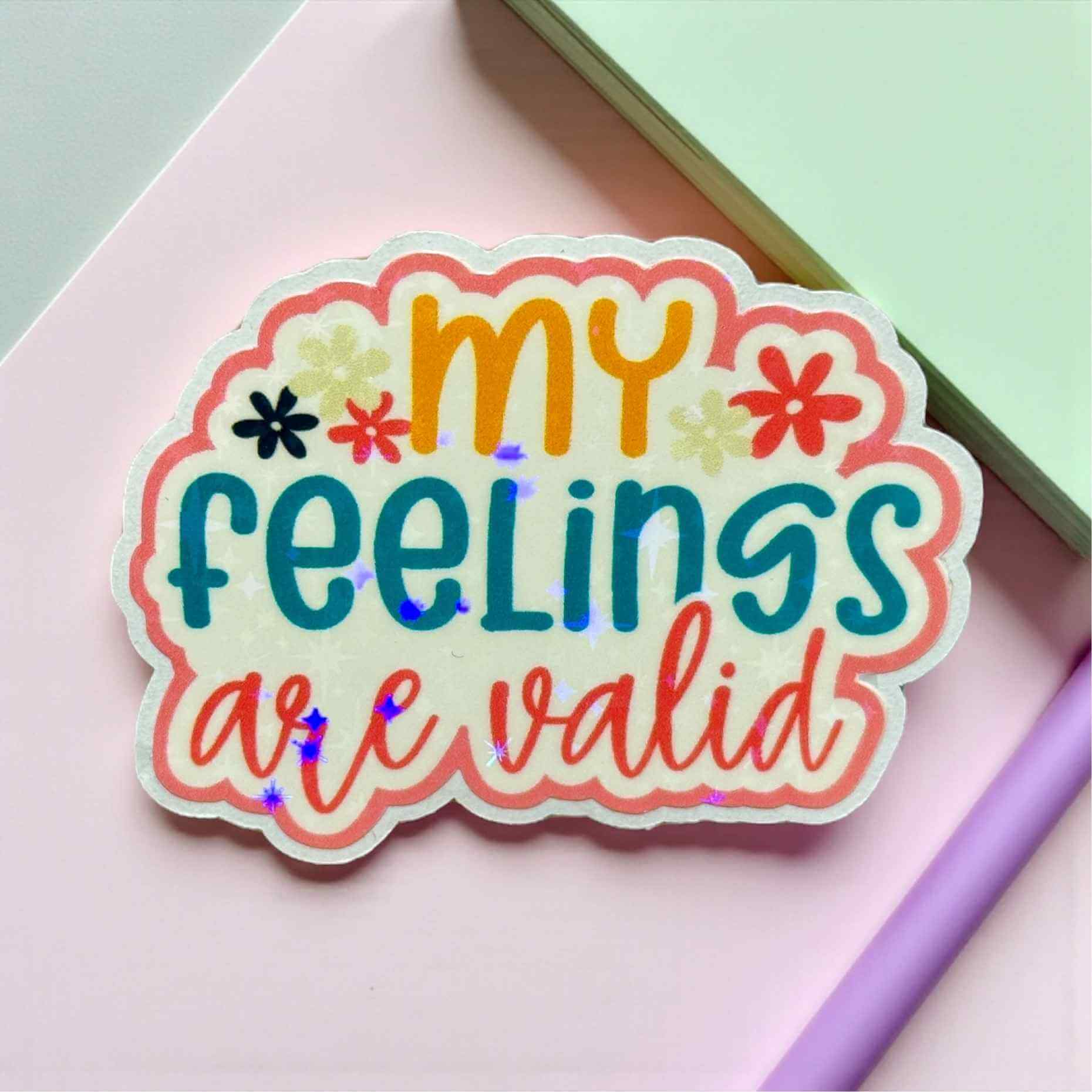 Colorful sticker with 'my feelings are valid' text on a pink background