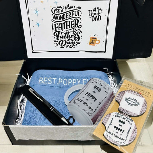 Gift set for Father's Day with towel, pen, coasters, and card in a box.