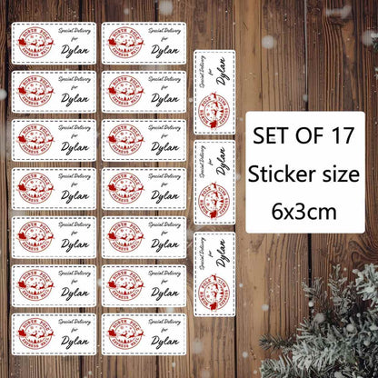 Set of 17 personalised Christmas stickers with a red and white design on a wooden background.
