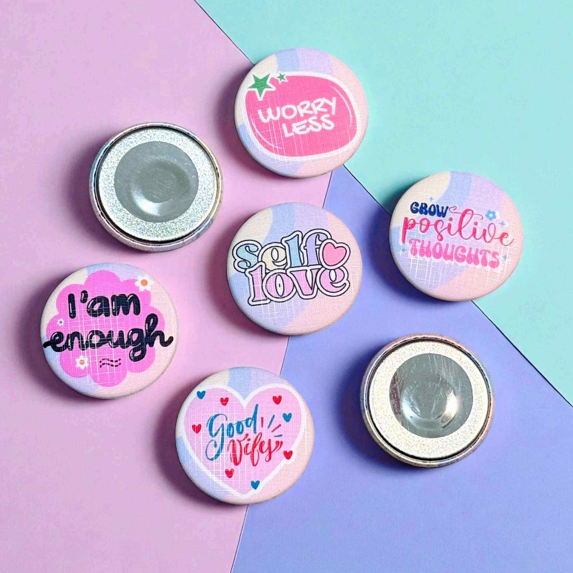 Positive vibes decorative magnets showing both front designs and back magnetic mechanisms - 32mm custom magnets with secure magnetic hold