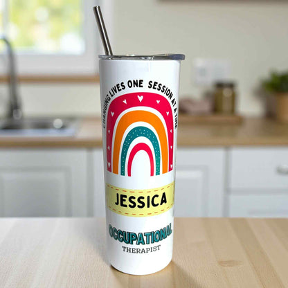 Occupational therapist Tumbler with rainbow design and text on a kitchen counter