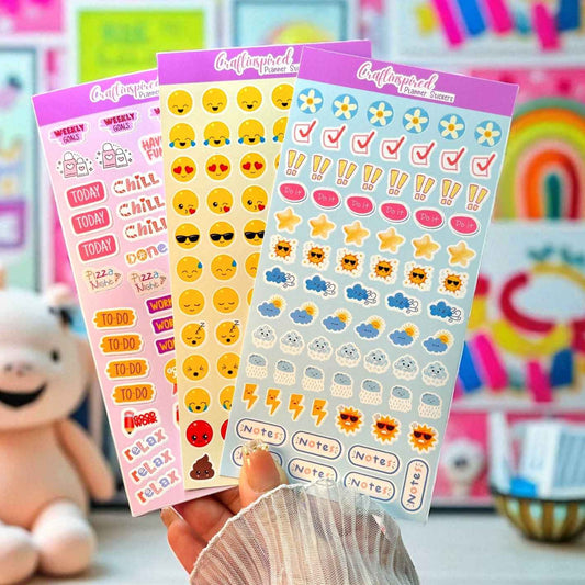 3 sheets of adorable kawaii planner stickers, with emojis stars and other planner sticker necessities.