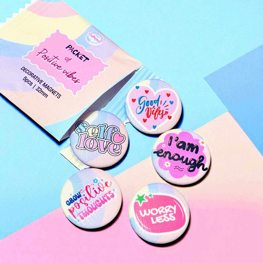 Packet of positive vibes decorative magnets featuring motivational messages including 'Self Love', 'Good Vibes', 'I am enough', 'Grow Positive Thoughts', and 'Worry Less' - 32mm custom magnet set of 5